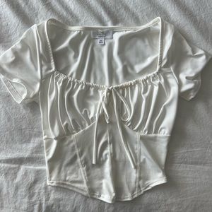 White corset-like crop top